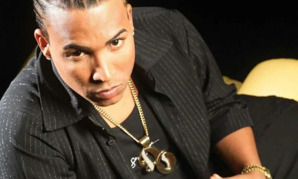 A person with cornrows gazes