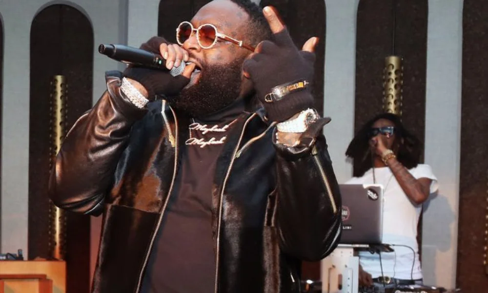 A performer in a leather jacket and sunglasses-rick ross net worth