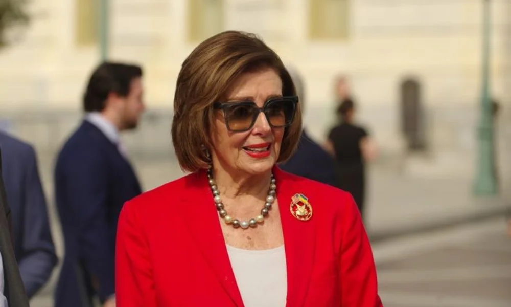 A woman in a bright red blazer