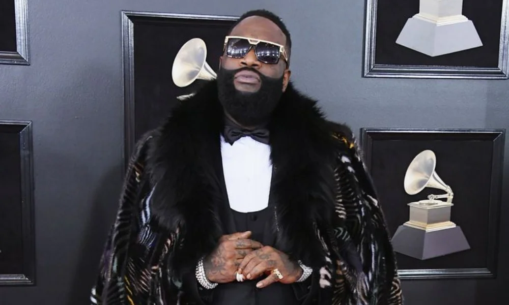 Man in a luxurious fur coat and sunglasses-rick ross net worth