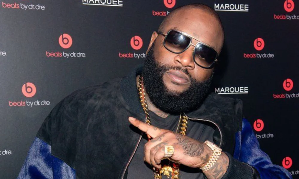 Man in sunglasses and a black jacket poses confidently-rick ross net worth