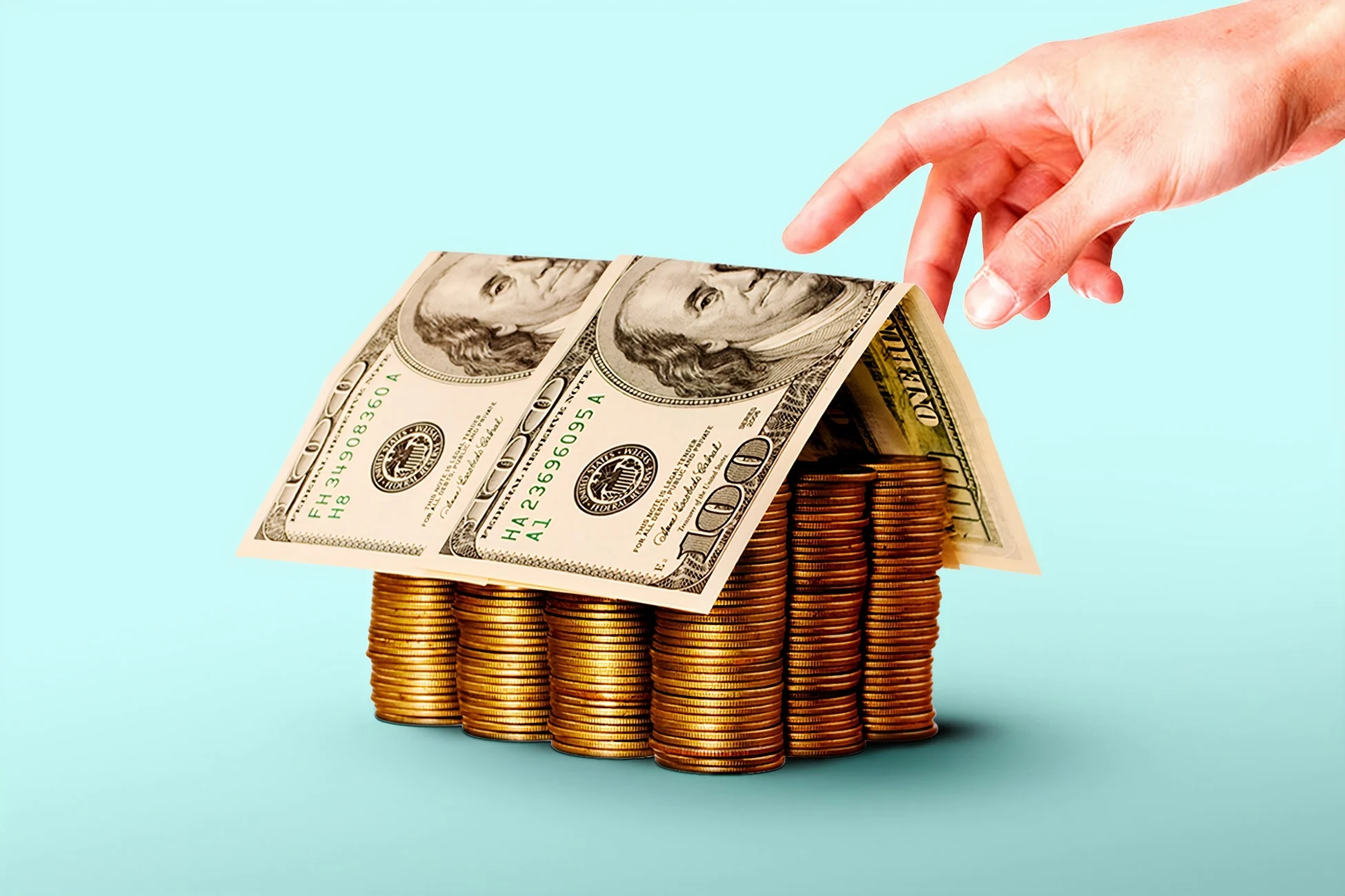 A house made of coins and dollar bills representing the diversified net worth and asset structure of Mariano Iduba in 2026 – marianoiduba