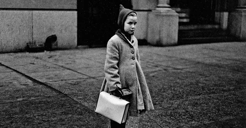 Diane Arbus photograph of a young girl in a pointed hood