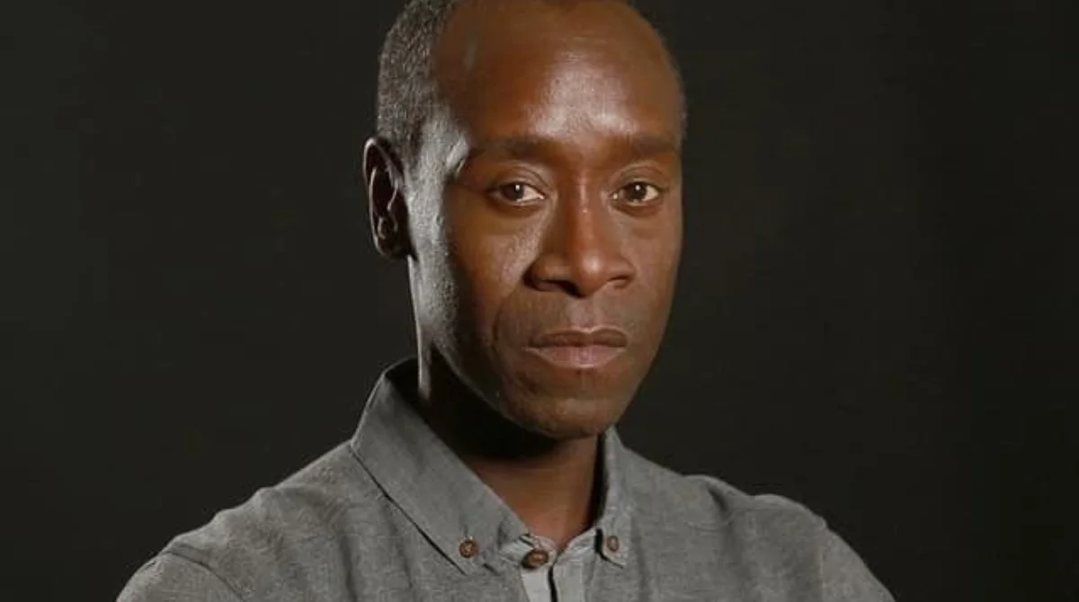 A man in a gray button-up shirt