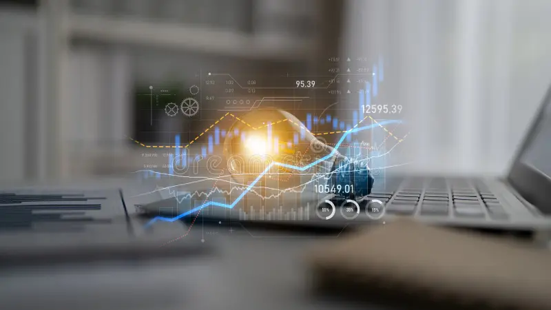 modern creative professional workspace laptop financial charts digital products concept